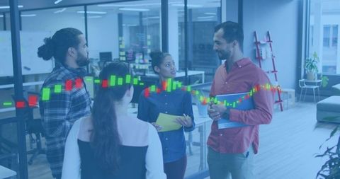 Diverse startup team collaborating around glass office with candlestick stock chart overlay