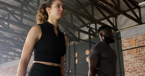 Focused training partners in urban industrial gym