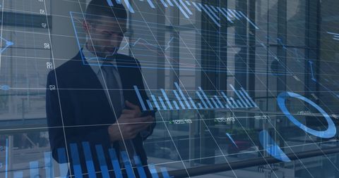 Businessman Analyzing Financial Data with Smart Technology Overlay