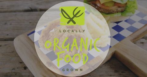 Locally grown organic food logo overlay on rustic wood board showing burger and sides