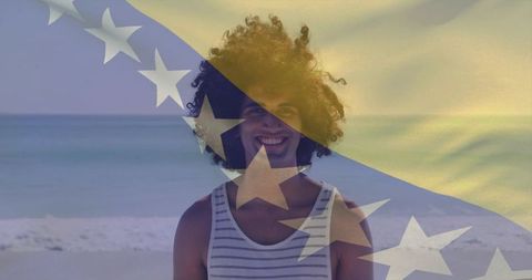 Smiling man on sunny beach with bosnia and herzegovina flag overlay, summer travel