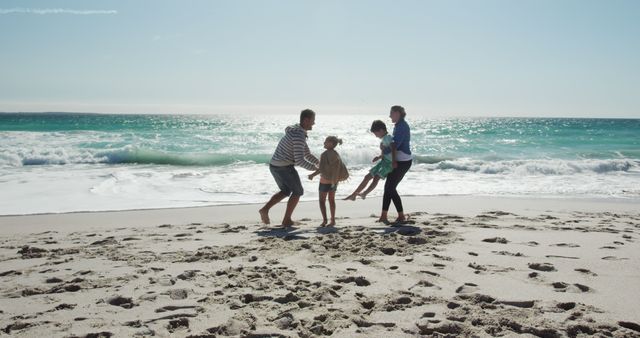 Family Enjoying Fun Day at the Beach with Clear Blue Waters - Download Free Stock Images Pikwizard.com