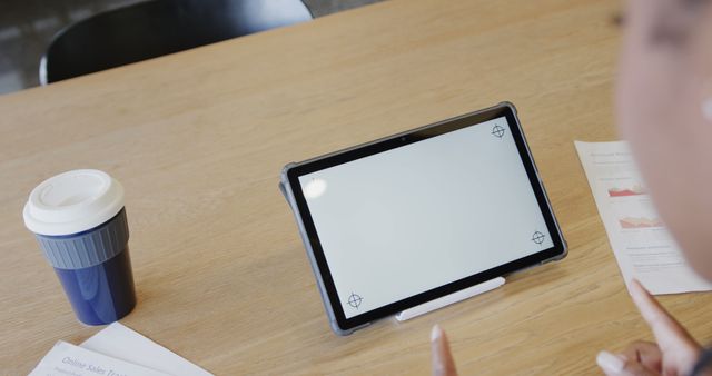 Tablet with blank screen on desk near takeaway coffee cup and documents - Download Free Stock Images Pikwizard.com