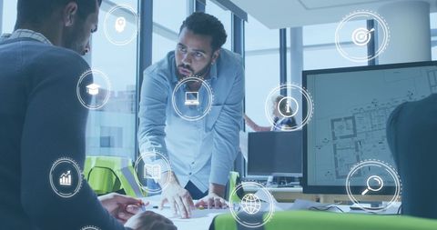 Team of Architects Collaborating on Blueprint with Digital Icon Overlays