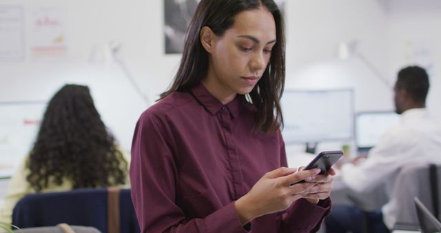 Businesswoman Texting on Smartphone in Modern Office - Download Free Stock Images Pikwizard.com