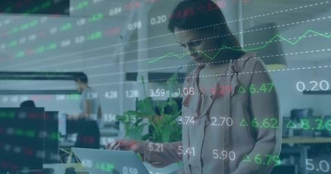 Businesswoman Working on Laptop with Stock Market Data Overlay