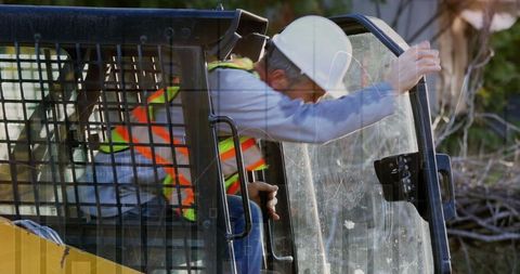 Construction Worker Entering Vehicle with Overlaid Data - Download Free Stock Images Pikwizard.com