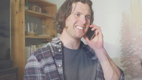 Smiling Man Talking on Smartphone with Winter Landscape Overlay