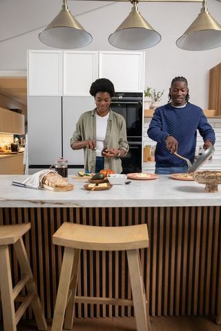 Couple Cooking Together in Modern Kitchen Enhances Cozy Lifestyle