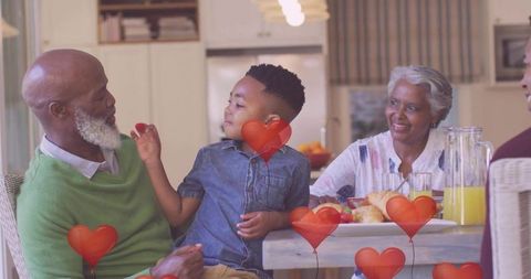 Joyful Family Gathering During Breakfast with Fresh Orange Juice
