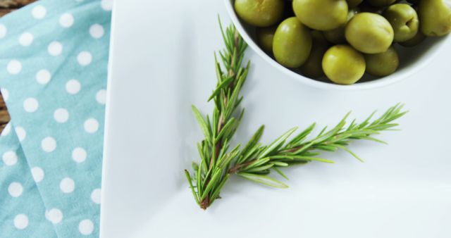 Fresh Green Olives in Bowl with Rosemary on White Plate - Download Free Stock Images Pikwizard.com