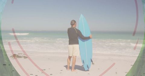 Man with Surfboard Mentally Preparing to Venture into Ocean Waves