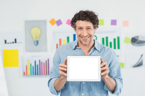 Smiling Man with Transparent Tablet Display in Office Setting - Download Free Stock Videos Pikwizard.com