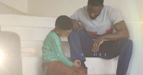 Loving Father-Son Moment with Shoe Tying - Download Free Stock Images Pikwizard.com