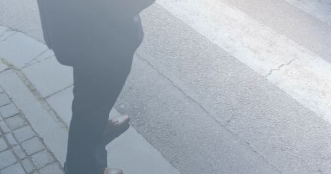Businessperson Waiting to Cross Urban Street