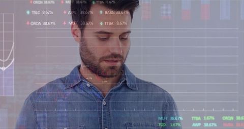 Bearded man analyzing augmented financial display with line charts in modern office