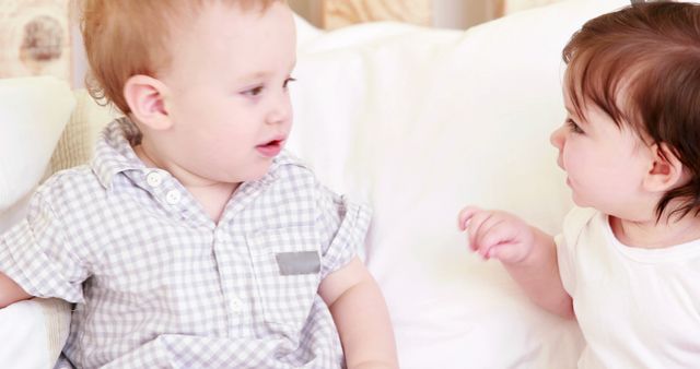 Adorable Babies Talking on Bed in Bright Room - Download Free Stock Images Pikwizard.com