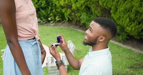Romantic park proposal and joyful surprise
