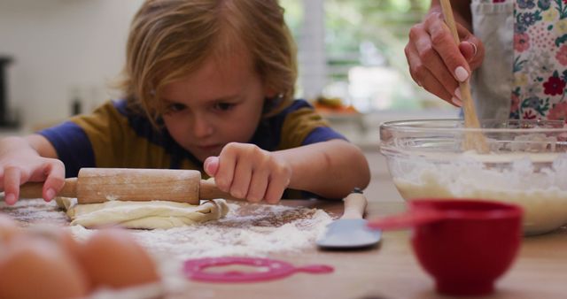 Young Child Focused on Rolling Dough in Bright Kitchen - Download Free Stock Images Pikwizard.com