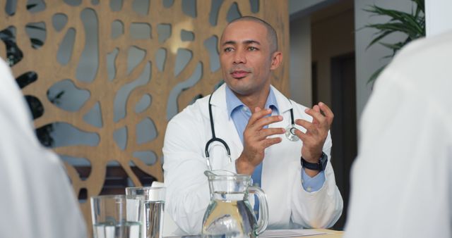 Medical Professional Discussing Treatment in Meeting Room - Download Free Stock Images Pikwizard.com