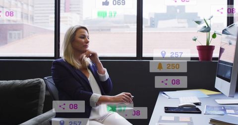 Businesswoman Analyzing Social Media Metrics in Office