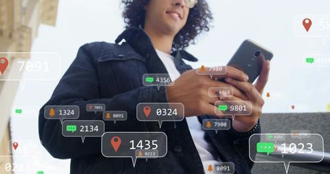 Young man tapping smartphone with augmented reality chat and map overlays on street