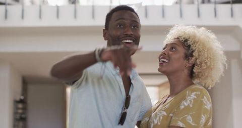 Joyful Couple Embraces in Modern Home Interior