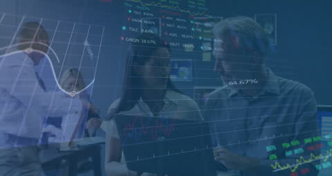 Colleagues Analyzing Stock Trends in Modern Office Environment