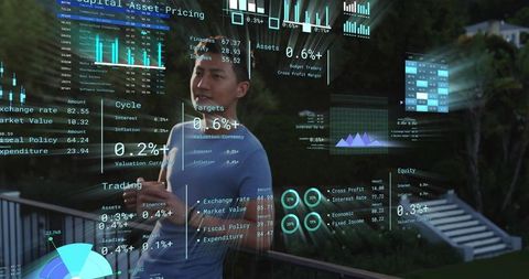 Asian male holding coffee analyzing holographic financial charts on balcony at dusk tech
