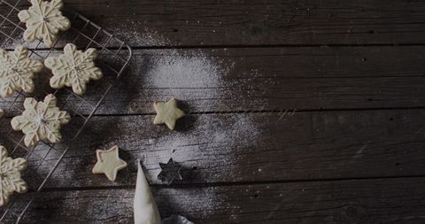 Rustic Baking Scene with Star-Shaped Cookies and Powdered Sugar - Download Free Stock Images Pikwizard.com
