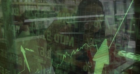 Financial analyst analyzing stock market trends at desk