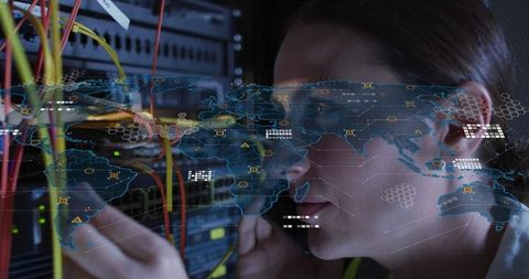 IT Technician Managing Server with Digital World Map Overlay