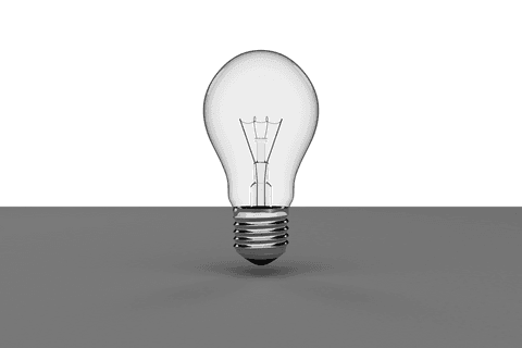 Transparent black light bulb on gray surface