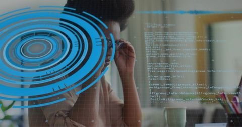 Businesswoman working with holographic technology at office