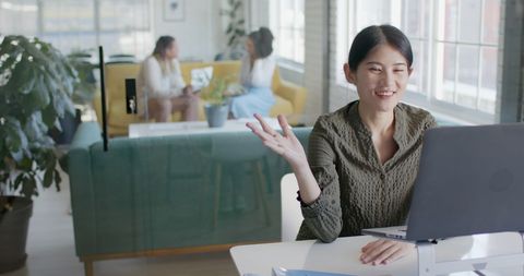 Asian Businesswoman in Video Conference Call at Office Desk - Download Free Stock Images Pikwizard.com
