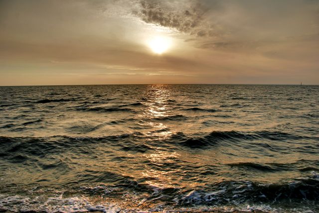 Tranquil Ocean Waves During Golden Sunset - Download Free Stock Photos Pikwizard.com