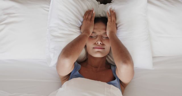 Stressed Woman Lying in Bed with Headache - Download Free Stock Images Pikwizard.com