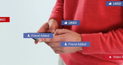 Hands holding smartphone showing social media notifications, liked and friend added badges