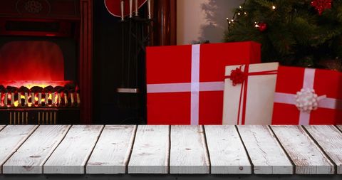 Festive Wooden Table with Christmas Gifts and Fireplace