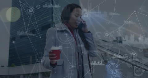 Businesswoman Communicating on Smartphone with Data Visualization Overlay