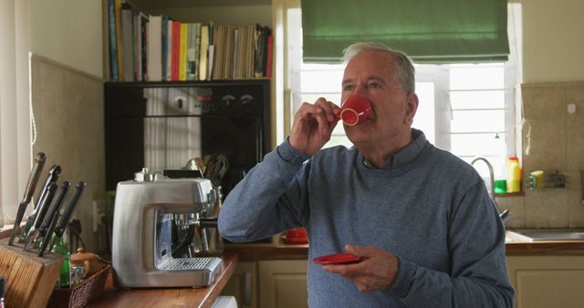 Senior man enjoying coffee in home kitchen with espresso machine - Download Free Stock Images Pikwizard.com