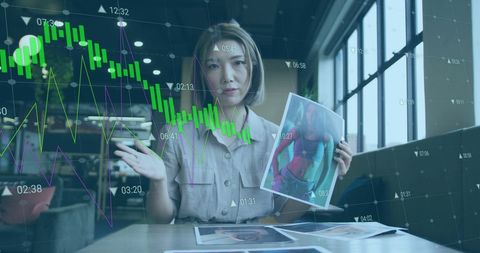 Businesswoman Presenting Designs via Video Call with Financial Data Overlay