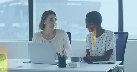 Colleagues Collaborating in Modern Office with Technology Tools