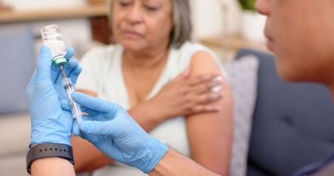 Healthcare Professional Administering Vaccine to Senior Woman - Download Free Stock Images Pikwizard.com