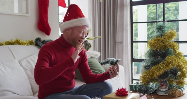 Man Wearing Santa Hat Video Calling at Home During Christmas Holidays - Download Free Stock Images Pikwizard.com