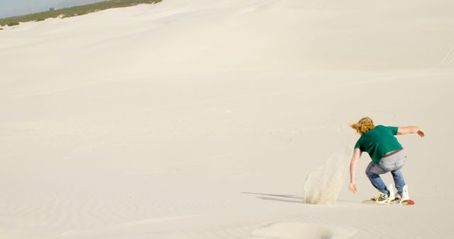Man Sandboarding on White Sand Dune - Download Free Stock Images Pikwizard.com