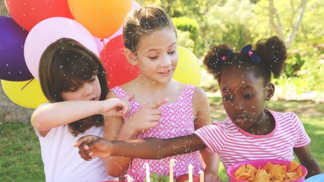 Children gathered at a birthday party outdoors, with colorful balloons and snacks, animated with digital network overlays. Perfect for themes on technology, childhood celebrations, social connections, and community events.