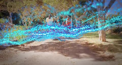 Tech Particle Animation Enhances Family Outdoor Exploration