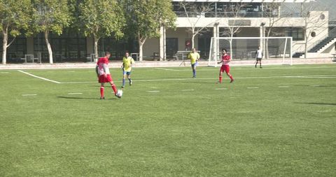 Youth Soccer Players Showcasing Team Spirit on School Field