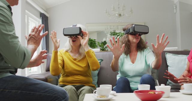 Seniors Enjoying Virtual Reality Experience in Living Room - Download Free Stock Images Pikwizard.com